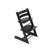 Black wooden high chair with adjustable seat and footrest. 
