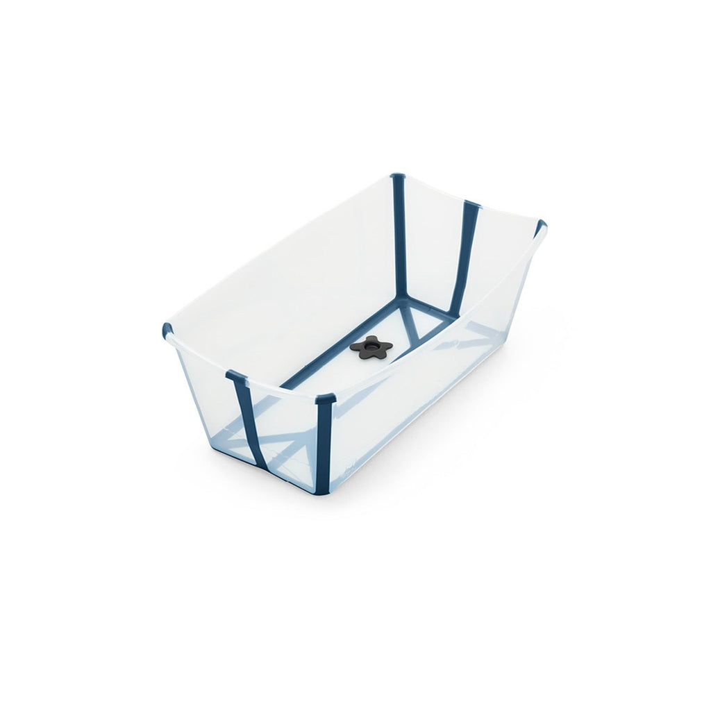 Clear plastic baby bathtub with blue trim and a black drain plug. 
