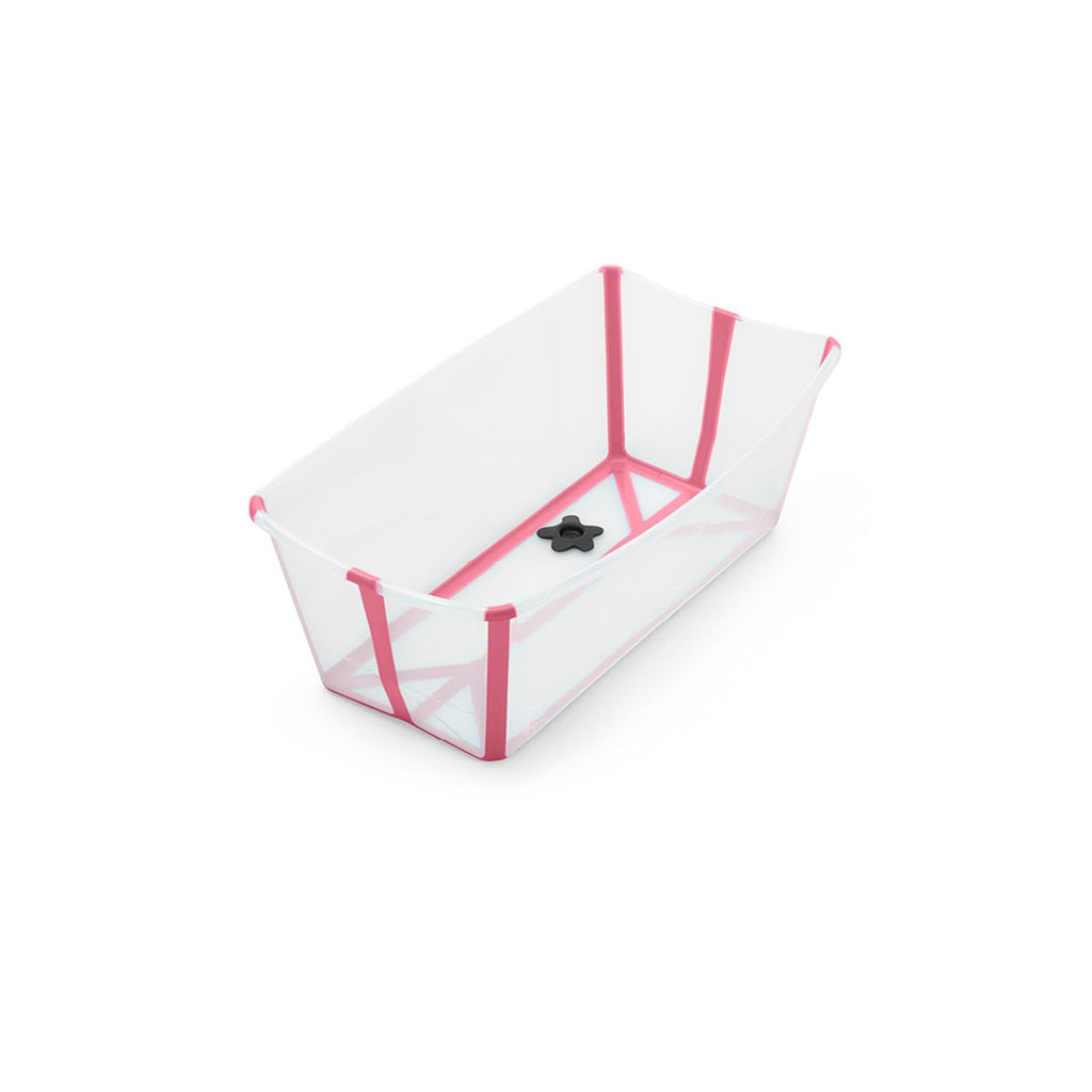 Empty white and pink plastic baby bathtub with drain plug. 

