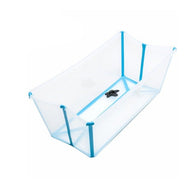 Clear plastic baby bathtub with blue trim, shown empty and angled. 
